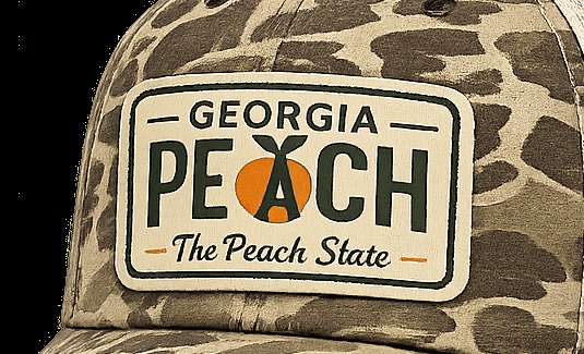 Macro close-up of the embroidered Georgia Peach patch